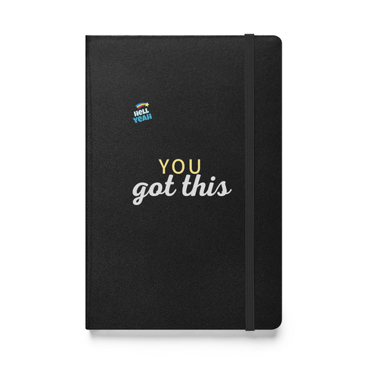 Schwarzes Notizbuch mit dem Text: „YOU got this“ und kleinem Sticker „Hell Yeah“.